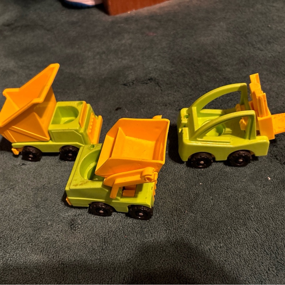 Fisher price construction vehicle lot. Forklift, dump truck, front loader.